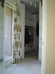Master bedroom with sliding door to balcony and large walk in closet 